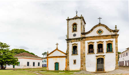 Historic church facade and surrounding houses in the ancient city of Paraty on the south coast of the state of Rio de Janeiro, Brazilの写真素材