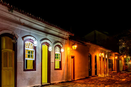 Stone street and colonial style houses illuminate at night in the city of Paraty on the coast of Rio de Janeiro, Brazilの写真素材