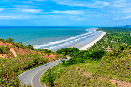 Beautiful road along the coast of the state of Bahia next to the beaches of Pe de Serra and Sargi in Serra Grandeの写真素材