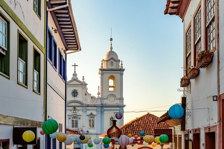 Houses and church in the streets of the city of Diamantina decorated with colorful lanterns and light fixturesの写真素材