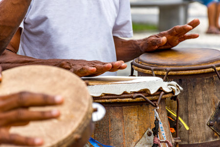 Percussionists playing their instruments during a capoeira performance in a Pelourinho square in the city of Salvador, Bahiaの写真素材