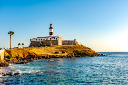 Sunset at the famous Farol da Barra in the city of Salvador, Bahiaの写真素材