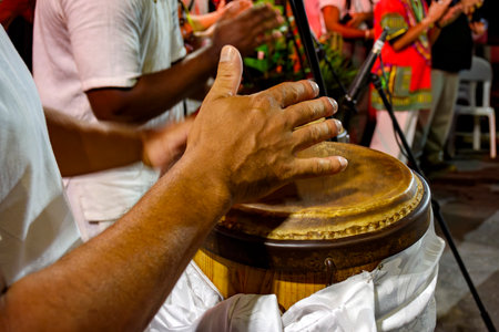 Atabaque player during a musical performance on the streets of Brazilの写真素材