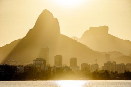 Sunset at the Rodrigo de Freitas lagoon in the city of Rio de Janeiro with the Gavea stone and Two Brothers hillの写真素材