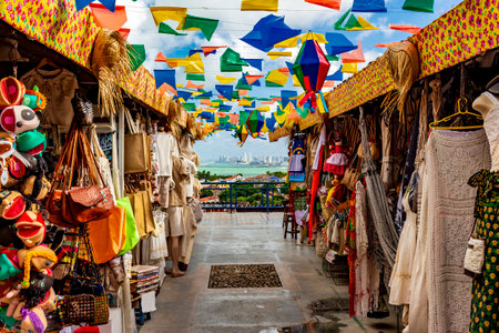Brazilian street with shops for tourists in Olinda with a view of the city of Recife in the backgroundの写真素材