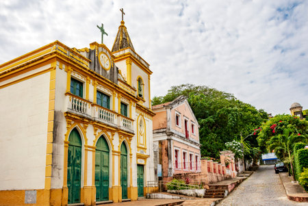 Slope in the city of Olinda with historic church and colonial-style houses (Edited)の写真素材