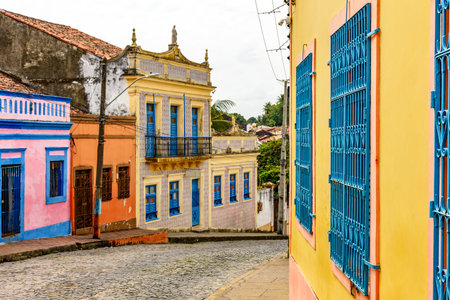 Old and colorful houses on the streets and slopes of the historic city of Olindaの写真素材