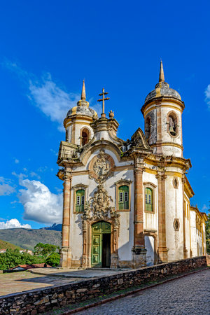 Baroque cathedral in the historic city of Ouro Preto illuminated by the sunの写真素材