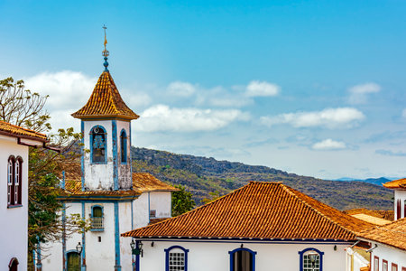 Church tower with bell and colonial houses in the city of Diamantina in Minas Geraisの写真素材
