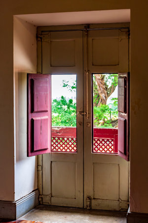 Old door with windows inside an old colonial style house in the historic city of Olinda in Pernambucoの写真素材
