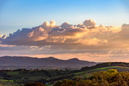 Sunset between the mountains and valleys of Carrancas in the state of Minas Geraisの写真素材