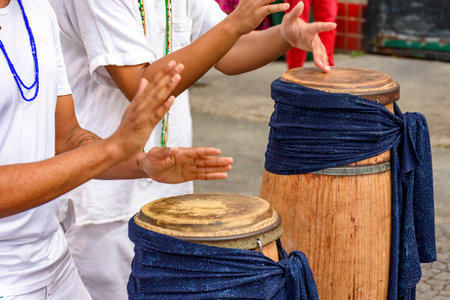 Atabaque, a traditional African drums being played on the streets of Brazil during Umbanda festivitiesの写真素材