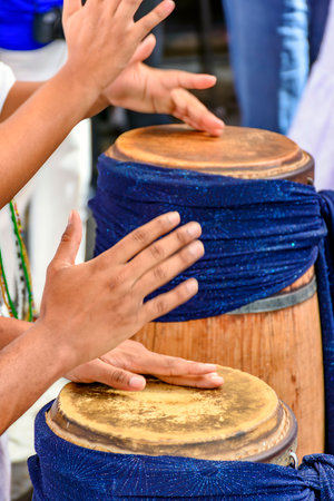 Traditional atabaques being played on the streets of Brazil during Umbanda festivitiesの写真素材