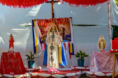 Colorful altar decorated with images of Catholic saints and the Virgin Maryの写真素材