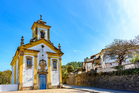 Street in the city of Ouro Preto between historic houses and churchesの写真素材