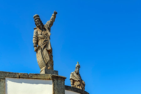 Image of two of the 12 biblical prophets sculpted by Aleijadinho in the sanctuary of Bom Jesus de Matosinhos in Congonhasの写真素材