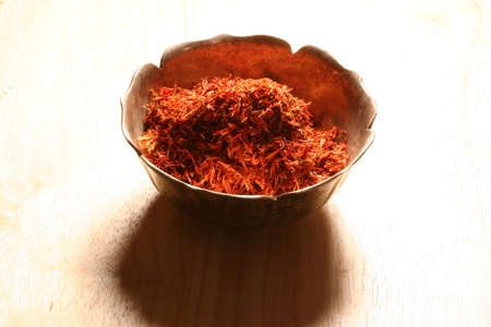 pile of saffron in a metal bowlの写真素材