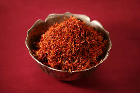 pile of saffron in a metal bowlの写真素材