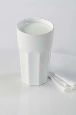 A white drugstore mug with fresh milkの写真素材