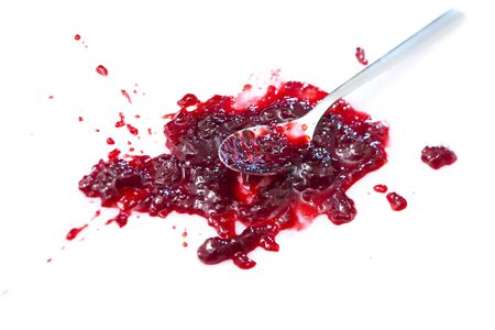 Blob of sour cherry jam with spoonの写真素材
