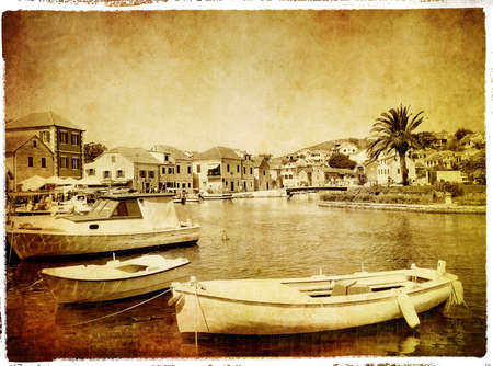 landscape with boats - retro styled pictureの写真素材