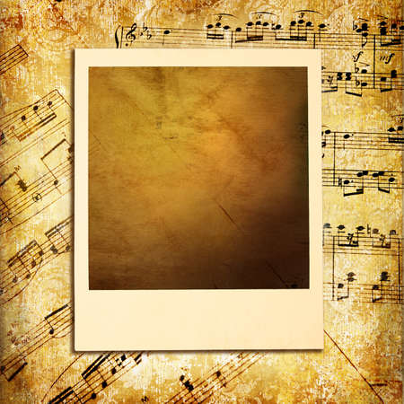 retro musical background with blank instant frameの写真素材
