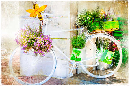 vintage postcard - charming street decoration with bike and flowersの写真素材