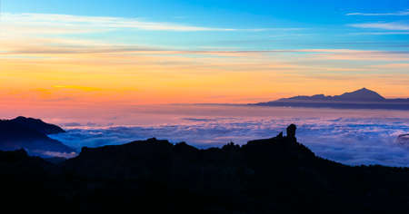 sunset over clouds - impressive mountains of Gran Canaria island, Roque Nubloの写真素材