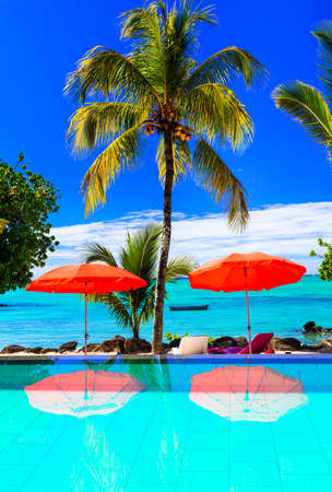 Tropical holidays in Mauritius Island, luxury relax in the swimming pool.