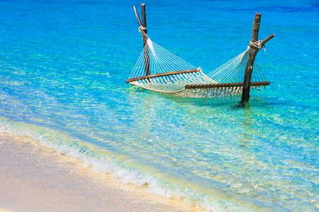 Tropical relax, view with azure sea and hammock, Mauritius island.の写真素材