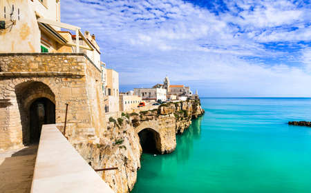 Beautiful Vieste village, view with traditional houses and Church, Puglia, Italyの写真素材