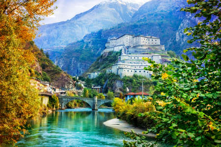 Impressive Bard fortress, view with river, bridge and mountains, Valle d'Aosta, Italy.の写真素材
