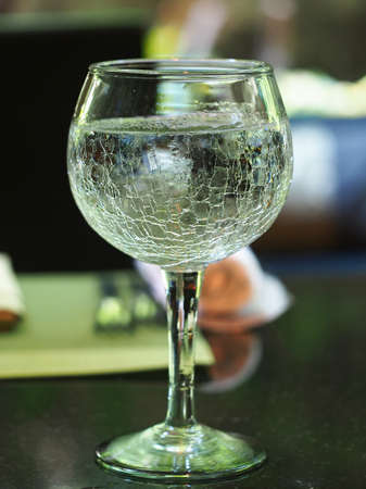Fragment of glass filled with water drink