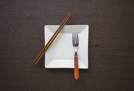 Empty dish on a wooden tableの写真素材