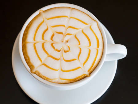 Coffee cup on wooden table ,soft focusの写真素材