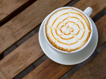 Coffee cup on wooden table ,soft focusの写真素材