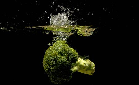 Photo of a vegetables dropped under waterの写真素材