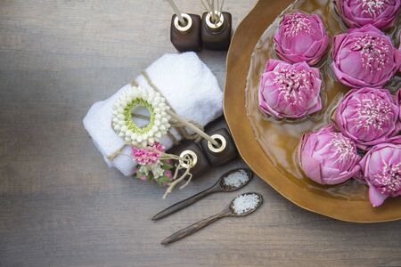 Spa massage compress balls, herbal ball with treaments spa and lotus , Thailand, soft focusの写真素材