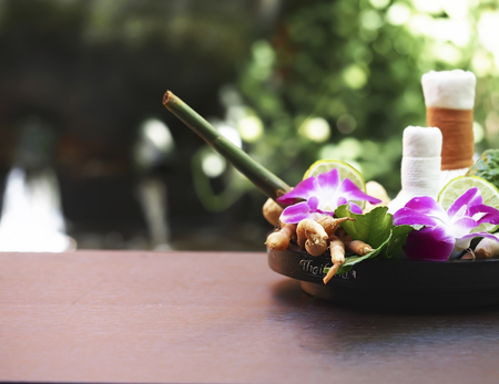 Natural Spa Ingredients herbal compress ball and herbal Ingredients for alternative medicine and relaxation Thai Spa theme with silk fabricの写真素材