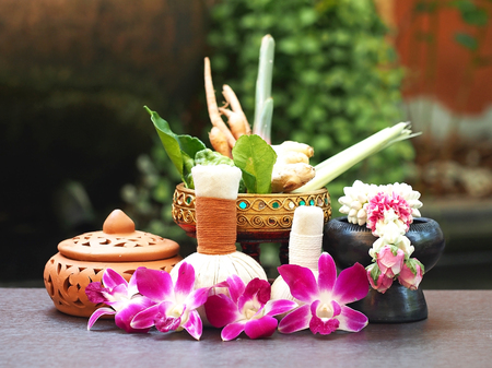 Natural Spa Ingredients herbal compress ball and herbal Ingredients for alternative medicine and relaxation Thai Spa theme with silk fabric , soft and select focusの写真素材