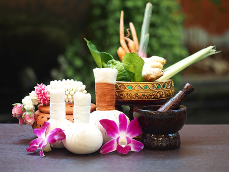 Natural Spa Ingredients herbal compress ball and herbal Ingredients for alternative medicine and relaxation Thai Spa theme with silk fabric , soft and select focusの写真素材