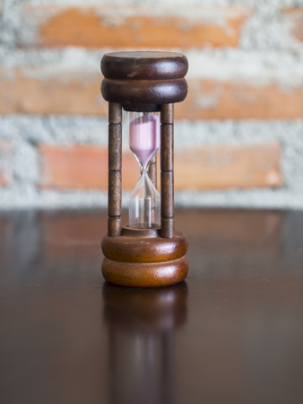 Closeup wooden hourglass ,stone backgroundの写真素材