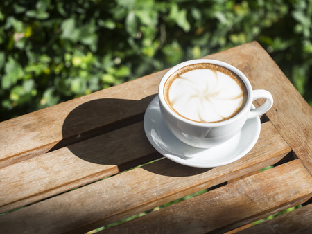 Coffee cup on wooden table ,soft focusの写真素材