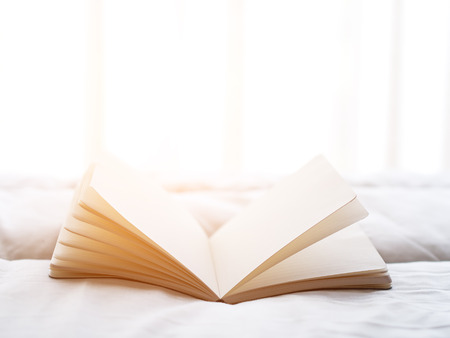 Fresh morning read book on the bed, soft focus.の写真素材