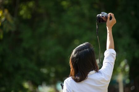 Woman take a photo in natureの写真素材