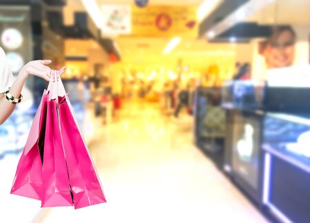 Beauty Woman with Shopping Bags in Shopping Mall. Shopper. Sales. Shopping Centerの写真素材