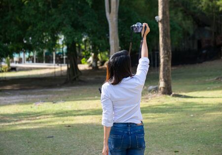 Woman take a photo in natureの写真素材