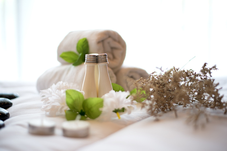 Spa treatment and product and relax spa with the bed and white flowers , Thailand. Greenery tone 2017, select focusの写真素材