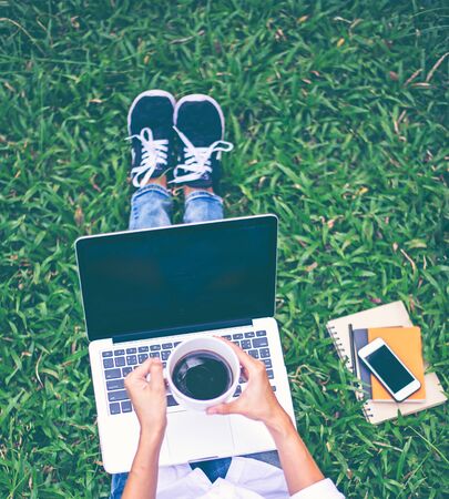 Women work in the park with labtop, relax workの写真素材