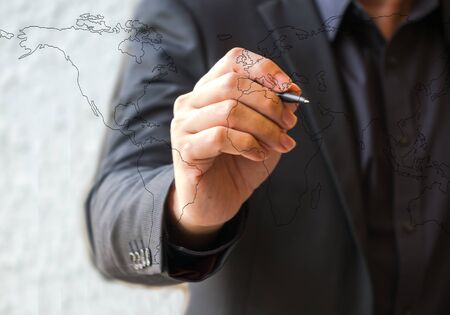 Clouse up hand business man drawing Worldの写真素材